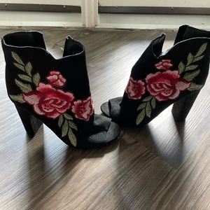 Black peep toe heels with rose detailing
